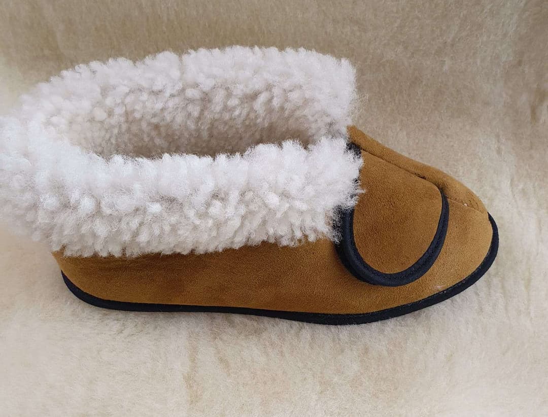 A pair of small slipper, brown with velcro