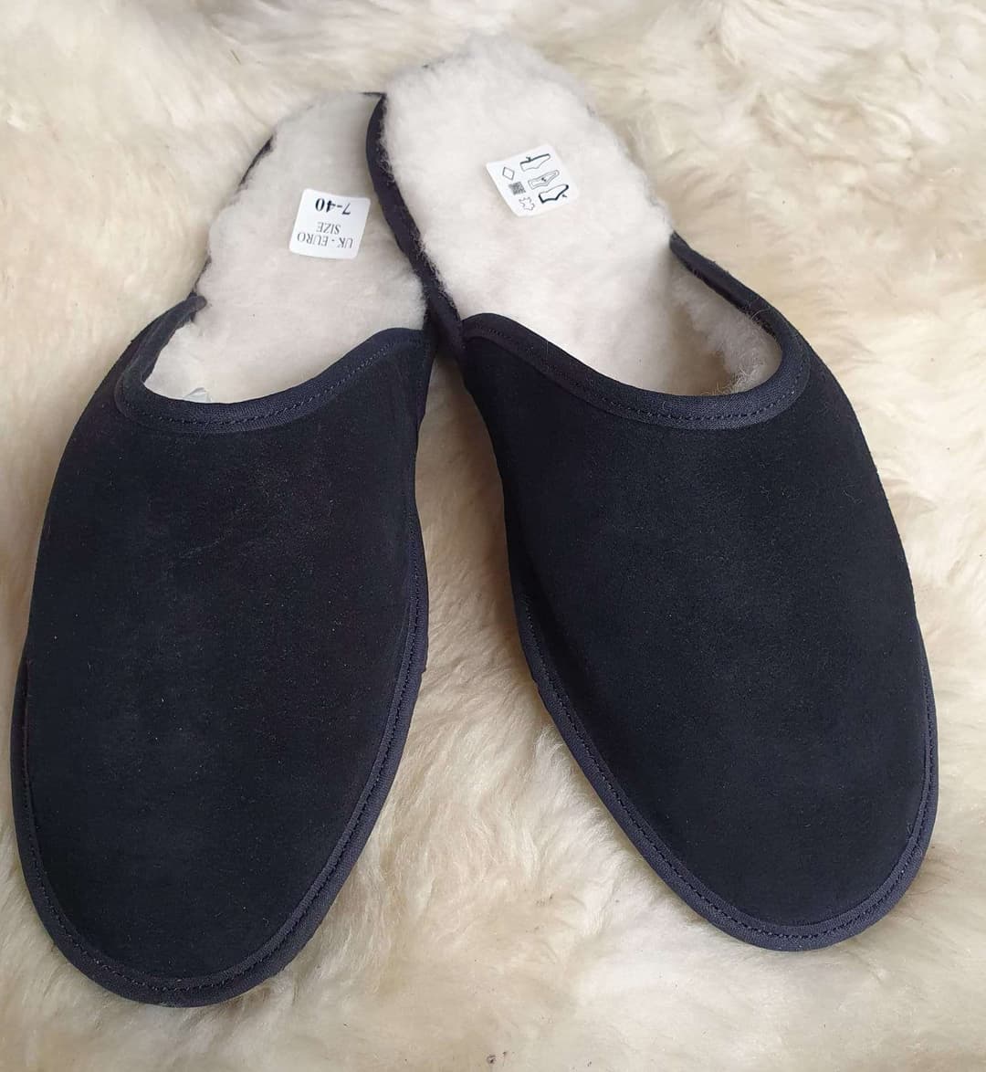 A pair of black slippers